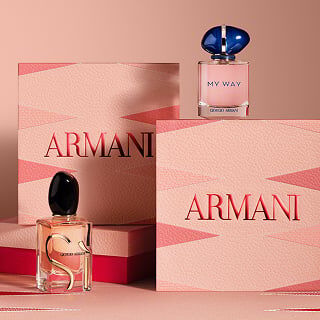 Mother’s Day Armani fragrance gift set featuring two pink patterned ARMANI boxes and two perfume bottles—My Way EDP and SI EDP—arranged on a soft blush backgammon background.