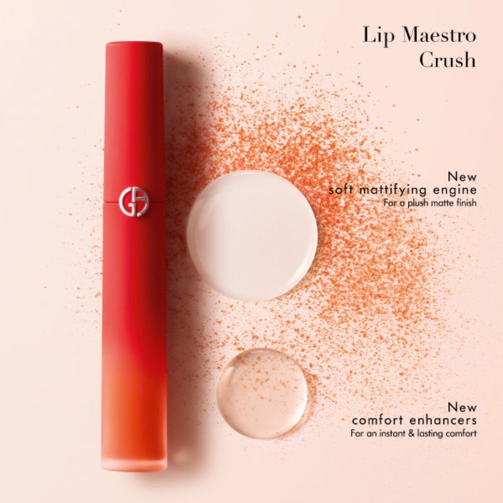 A beauty product advertisement featuring a gradient red Lip Maestro Crush tube, accompanied by circular swatches of a matte finish and powdery texture, highlighting new features for a plush matte finish and lasting comfort.