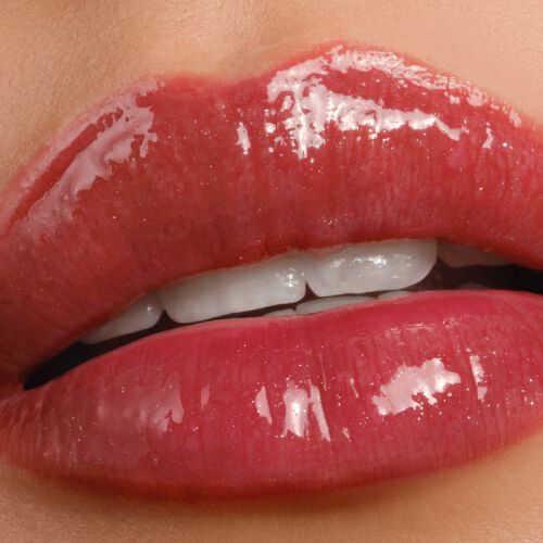 Armani Prisma Flash 44 Heat Flash lipstick on lips, displaying a fiery red shade with a bold, glossy finish.