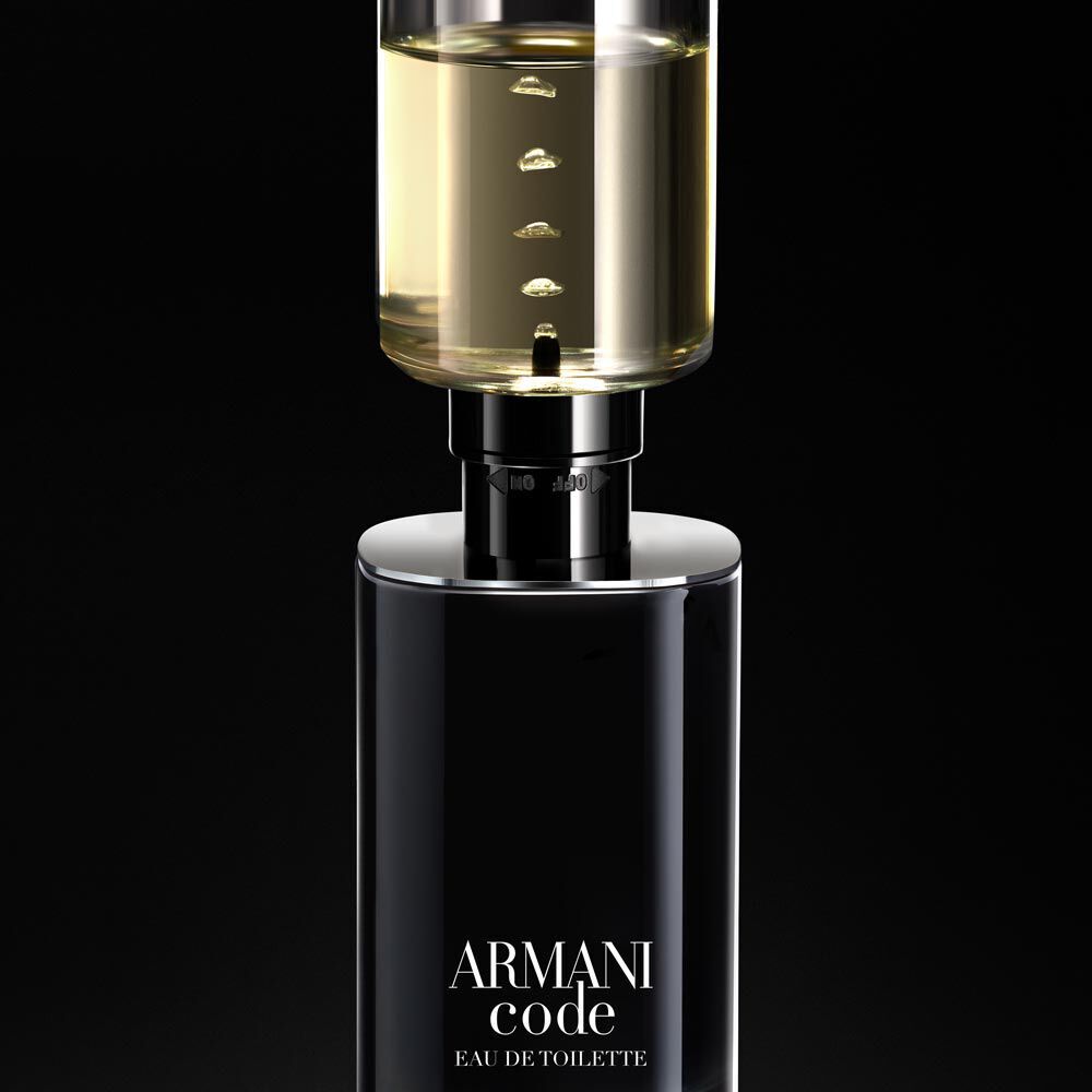 A sleek black bottle of Armani Code Eau de Toilette with a transparent top, revealing golden liquid inside, set against a dark background.