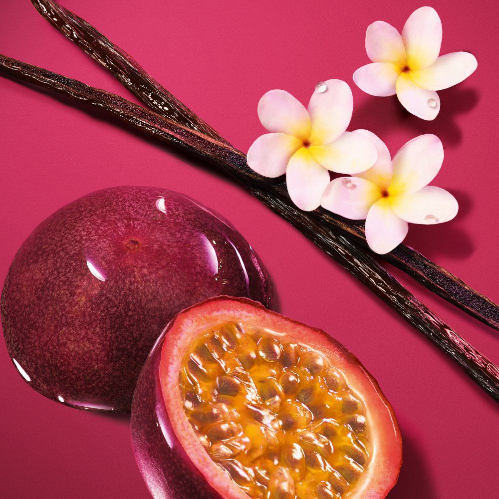 Maracuja (Passion fruit), vanilla beans, and frangipani flower floating in the radiant ruby liquid of the ARMANI POWER OF YOU perfume.