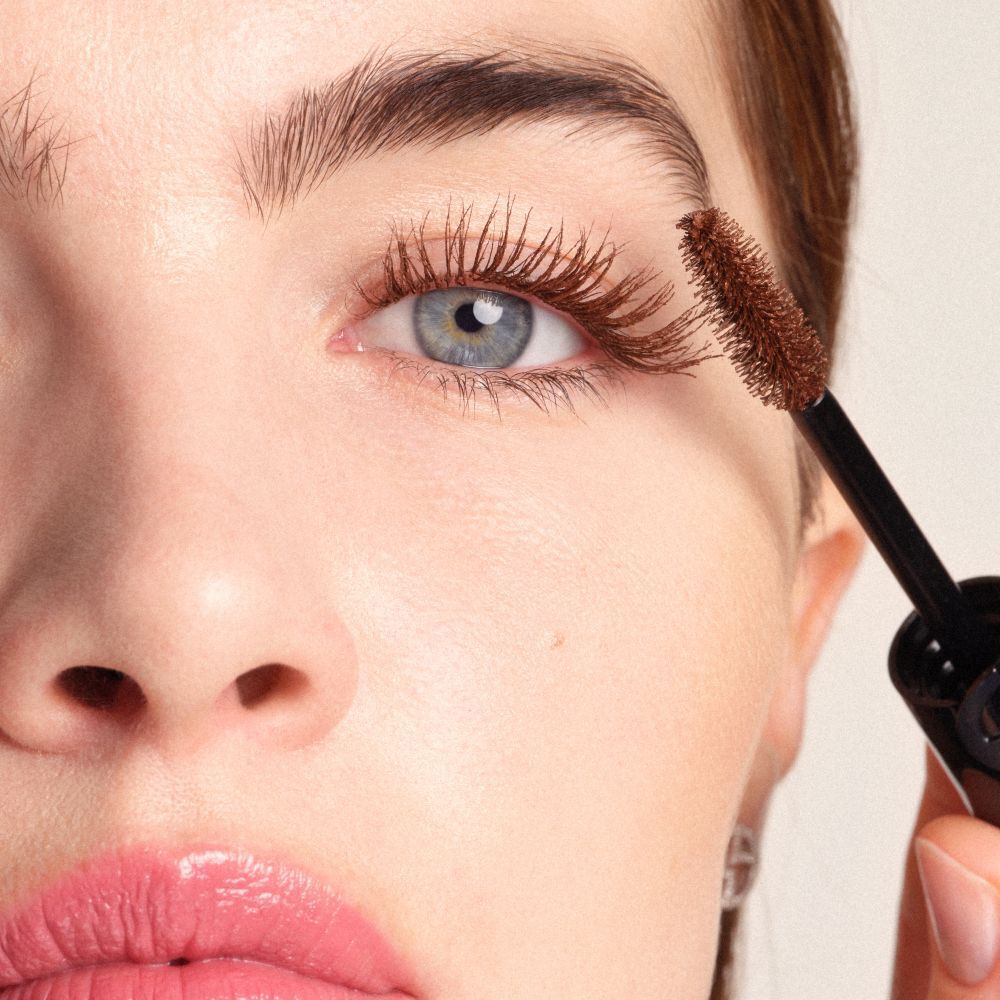 Applying Armani Beauty  VERTIGO DRAMA MASCARA to lift and define the lashes