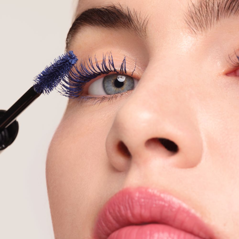 Applying Armani Beauty  VERTIGO DRAMA MASCARA to lift and define the lashes