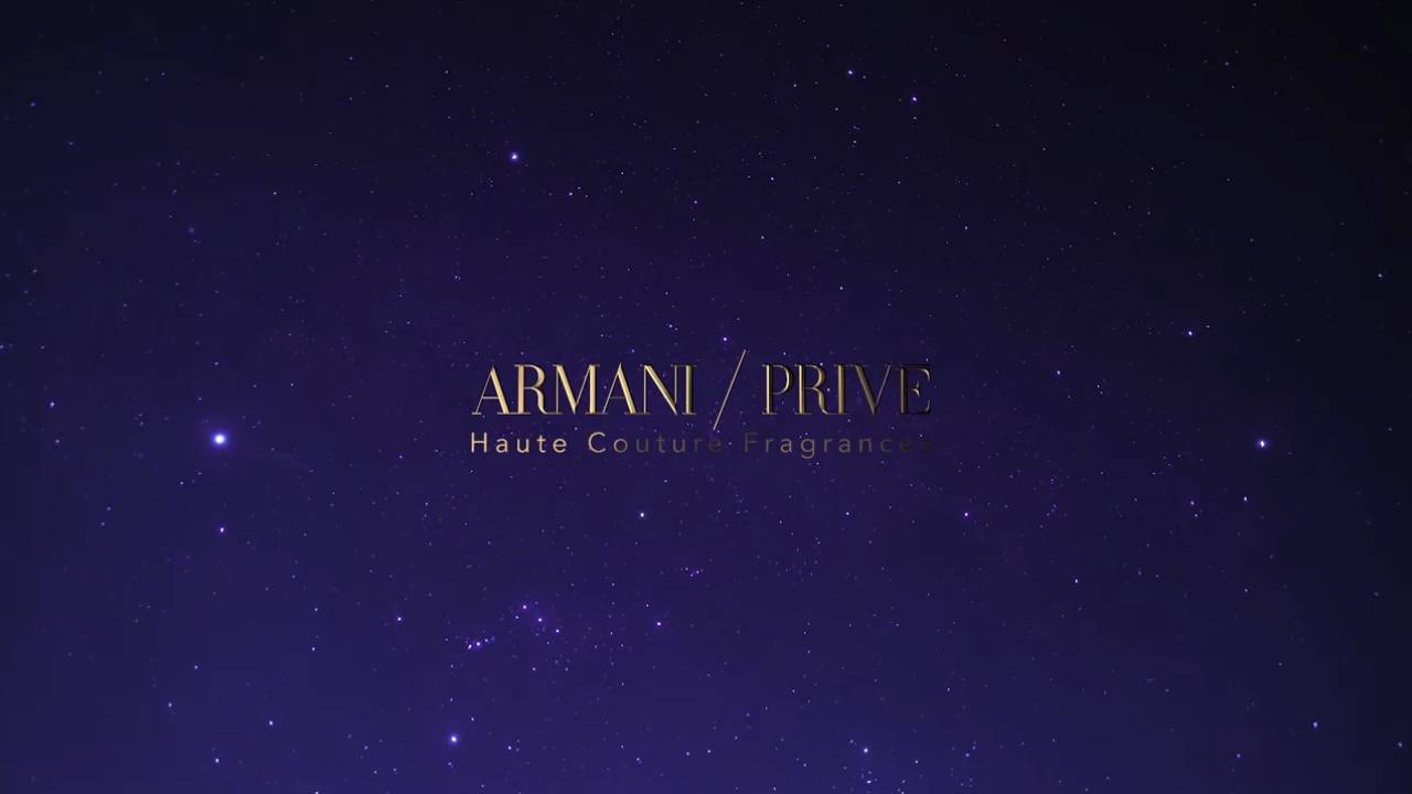 Logo d'Armani Privé sur fond étoilé, représentant un parfum de haute couture.